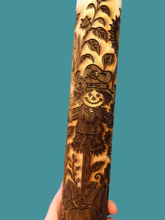 Sharon Hoppe Designs wooden rolling pin with engraved scarecrow, pumpkin, and sunflower fall harvest patterns