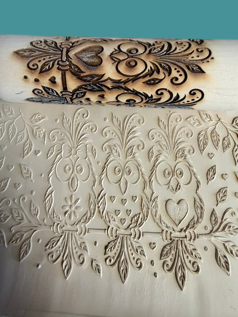Sharon Hoppe Designs wooden rolling pin with laser-engraved owl, heart, and floral pattern embossing on dough