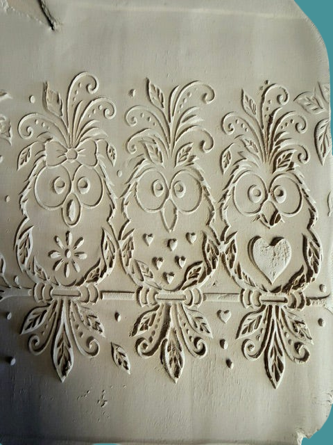 Sharon Hoppe Designs embossed clay impression featuring three whimsical owls with floral details and hearts