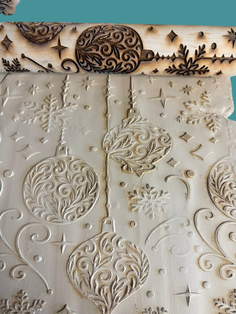 Sharon Hoppe Designs wooden rolling pin with laser-engraved Christmas ornaments and snowflakes embossing on clay