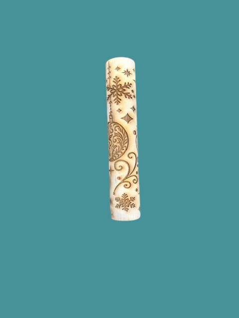Sharon Hoppe Designs wooden rolling pin with laser-engraved Christmas ornament, snowflake, and star patterns