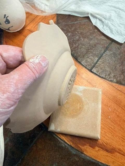 Sharon Hoppe Designs Sassy Blooms Press n Swoops clay template tool creating a decorative petal edge on a ceramic plate