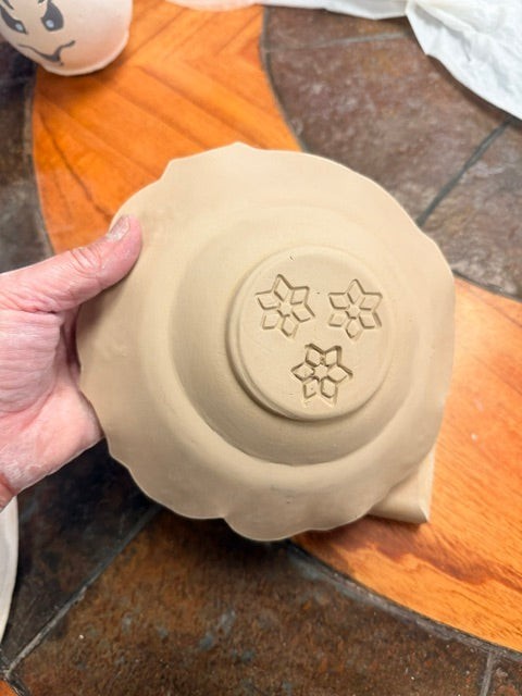 Sharon Hoppe Designs Sassy Blooms clay plate with a scalloped edge and three stamped flower designs on the base