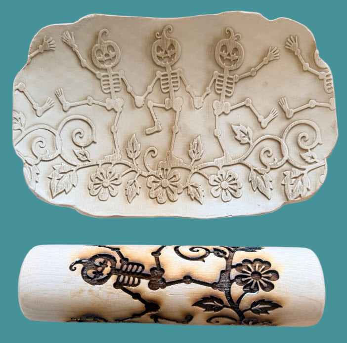 Sharon Hoppe Designs 7-inch wooden rolling pin with dancing skeleton and pumpkin pattern used on clay pottery