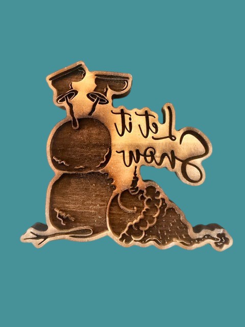 Sharon Hoppe Designs wooden Let it Snowman stamp featuring a snowman silhouette with engraved text and hat detail.